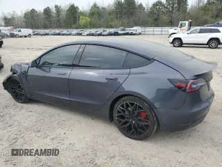 2021 Tesla Model 3 Performance with VIN 5YJ3E1EC5MF984986, listed as a Copart auction lot 52010205 with 48,012 mi miles and Salvage Title. Bid and sale history available at DreamBid. Image 2.