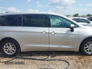 2023 Chrysler Pacifica Touring L with VIN 2C4RC1BG7PR521232, listed as a IAAI auction lot 42087909 with 34,609 mi miles and . Bid and sale history available at DreamBid. Image 12.
