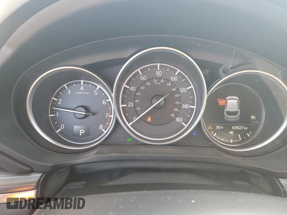 2018 Mazda CX-5 Grand Touring с VIN JM3KFADM2J1310339, выставлен на аукционе Copart как лот 64705245 с пробегом 63 927 миль миль и Списание • Salvage title. История ставок и продаж доступна на DreamBid. Изображение 9.