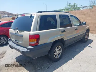2001 Jeep Grand Cherokee Laredo with VIN 1J4GX48S01C606559, listed as a IAAI auction lot 42384286 with 149,146 mi miles and . Bid and sale history available at DreamBid. Image 4.