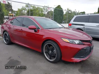 2019 Toyota Camry LE z VIN 4T1B11HKXKU243453, wystawiony jako IAAI lot #42201390 z przebiegiem 118 763 mil mil oraz . Historia ofert i sprzedaży dostępna na DreamBid. Obrazek 1.