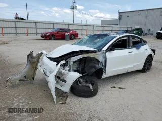 2021 Tesla Model 3 Standard Range Plus z VIN 5YJ3E1EA3MF976870, wystawiony jako Copart lot #58634625 z przebiegiem Nie podano mil oraz Nie do naprawy • Non repairable. Historia ofert i sprzedaży dostępna na DreamBid. Obrazek 1.