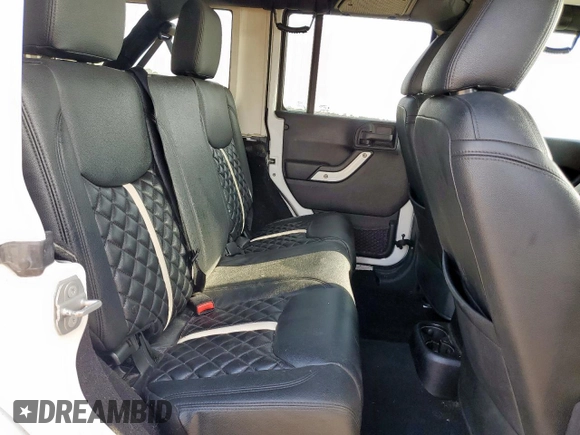 2015 Jeep Wrangler Unlimited Sport with VIN 1C4BJWDG9FL759012, listed as a Copart auction lot 61002465 with 101,395 mi miles and Salvage title. Bid and sale history available at DreamBid. Image 11.