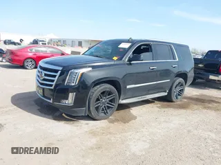 2015 Cadillac Escalade Luxury z VIN 1GYS4BKJ6FR291441, wystawiony jako IAAI lot #41881022 z przebiegiem 128 659 mil mil oraz . Historia ofert i sprzedaży dostępna na DreamBid. Obrazek 2.
