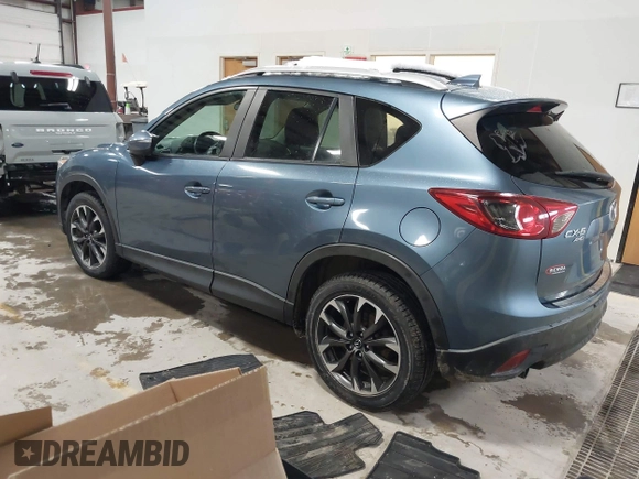 2016 Mazda CX-5 Grand Touring z VIN JM3KE4DY9G0714468, wystawiony jako IAAI lot #41860956 z przebiegiem 114 481 mil mil oraz . Historia ofert i sprzedaży dostępna na DreamBid. Obrazek 3.