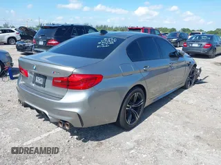 2019 BMW M5 Competition z VIN WBSJF0C50KB285924, wystawiony jako IAAI lot #41686677 z przebiegiem 44 238 mil mil oraz . Historia ofert i sprzedaży dostępna na DreamBid. Obrazek 4.