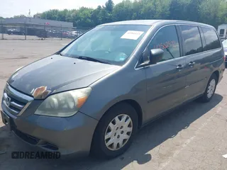 2007 Honda Odyssey LX with VIN 5FNRL38267B029066, listed as a IAAI auction lot 42502433 with 185,721 mi miles and . Bid and sale history available at DreamBid. Image 2.