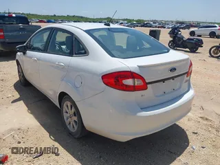 2012 Ford Fiesta SE with VIN 3FADP4BJ8CM161701, listed as a IAAI auction lot 42140579 with 59,496 mi miles. Bid and sale history available at carsss.com. Image 3.