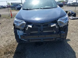2018 Toyota RAV4 Hybrid SE with VIN JTMJJREV9JD191552, listed as a IAAI auction lot 42158665 with 84,025 mi miles and . Bid and sale history available at DreamBid. Image 12.