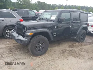 2019 Jeep Wrangler Unlimited Sport S with VIN 1C4HJXDG1KW603345, listed as a IAAI auction lot 42474523 with 90,048 mi miles and . Bid and sale history available at DreamBid. Image 2.