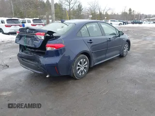 2021 Toyota Corolla Hybrid LE with VIN JTDEAMDE2MJ030035, listed as a IAAI auction lot 41644662 with 130,693 mi miles. Bid and sale history available at carsss.com. Image 4.