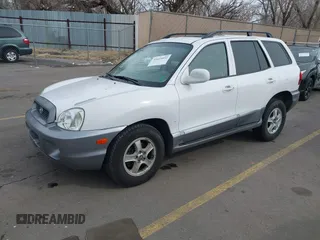 2004 Hyundai Santa Fe GLS with VIN KM8SC13DX4U609921, listed as a IAAI auction lot 41619492 with 113,592 mi miles. Bid and sale history available at carsss.com. Image 2.