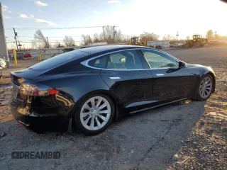 2019 Tesla Model S 75D with VIN 5YJSA1E23KF330239, listed as a Copart auction lot 86737544 with Not provided miles and Salvage title. Bid and sale history available at DreamBid. Image 3.