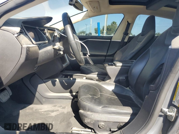 2013 Tesla Model S with VIN 5YJSA1CG9DFP09733, listed as a Copart auction lot 71574474 with 88,163 mi miles and Salvage title. Bid and sale history available at DreamBid. Image 7.