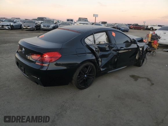 2015 BMW 6 Series 640i z VIN WBA6A0C59FD318390, wystawiony jako Copart lot #87831165 z przebiegiem Nie podano mil oraz Szkoda całkowita • Salvage title. Historia ofert i sprzedaży dostępna na DreamBid. Obrazek 3.