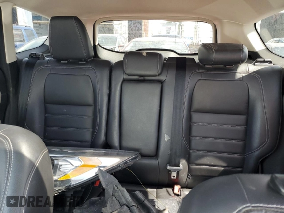 2018 Ford Escape Titanium z VIN 1FMCU9J94JUD09141, wystawiony jako Copart lot #56625805 z przebiegiem Nie podano mil oraz Szkoda całkowita • Salvage title. Historia ofert i sprzedaży dostępna na DreamBid. Obrazek 10.