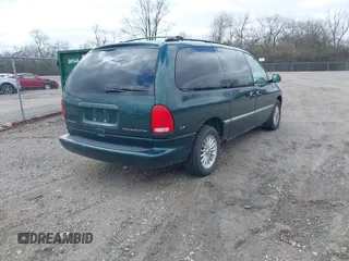 1999 Chrysler Town & Country with VIN 1C4GP54G6XB603564, listed as a IAAI auction lot 41823340 with 104,321 mi miles and . Bid and sale history available at DreamBid. Image 4.