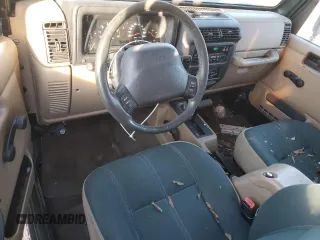 2002 Jeep Wrangler Sahara z VIN 1J4FA59S12P757177, wystawiony jako Copart lot #42808925 z przebiegiem 71 049 mil mil oraz Czysty tytuł • Clean title. Historia ofert i sprzedaży dostępna na DreamBid. Obrazek 8.