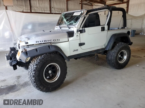 2006 Jeep Wrangler Rubicon with VIN 1J4FA69S26P734731, listed as a Copart auction lot 52009295 with 117,872 mi miles and Salvage title. Bid and sale history available at DreamBid. Image 1.