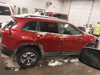2015 Jeep Cherokee Trailhawk with VIN 1C4PJMBS2FW609999, listed as a IAAI auction lot 41582536 with 133,666 mi miles. Bid and sale history available at carsss.com. Image 13.