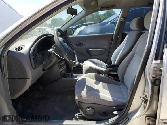 2004 Kia Spectra GS with VIN KNAFB161945141309, listed as a Copart auction lot 52395445 with 99,100 mi miles and Clean Title. Bid and sale history available at DreamBid. Image 7.