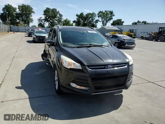 2015 Ford Escape Titanium with VIN 1FMCU0J97FUC80446, listed as a Copart auction lot 58749895 with 106,890 mi miles and Salvage title. Bid and sale history available at DreamBid. Image 14.