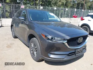 2020 Mazda CX-5 Touring with VIN JM3KFBCM6L1828691, listed as a IAAI auction lot 42100409 with 25,182 mi miles. Bid and sale history available at carsss.com. Image 1.