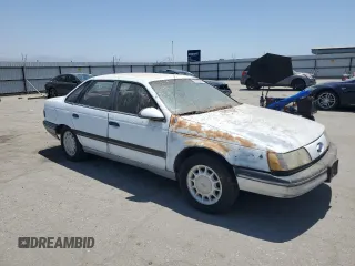 1989 Ford Taurus GL z VIN 1FABP52UXKG244224, wystawiony jako Copart lot #59239225 z przebiegiem 30 853 mil mil oraz Czysty tytuł • Clean title. Historia ofert i sprzedaży dostępna na DreamBid. Obrazek 4.