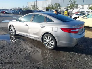 2013 Hyundai Azera z VIN KMHFH4JG3DA230844, wystawiony jako IAAI lot #41817997 z przebiegiem 129 163 mil mil oraz . Historia ofert i sprzedaży dostępna na DreamBid. Obrazek 3.
