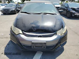 2010 Honda Insight LX with VIN JHMZE2H59AS041185, listed as a Copart auction lot 64517415 with 208,242 mi miles and Salvage title. Bid and sale history available at DreamBid. Image 5.