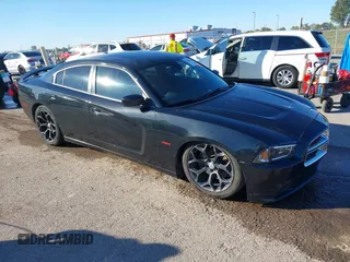 2014 Dodge Charger RT z VIN 2C3CDXCT9EH105353, wystawiony jako IAAI lot #40600827 z przebiegiem 206 839 mil mil oraz . Historia ofert i sprzedaży dostępna na DreamBid. Obrazek 1.