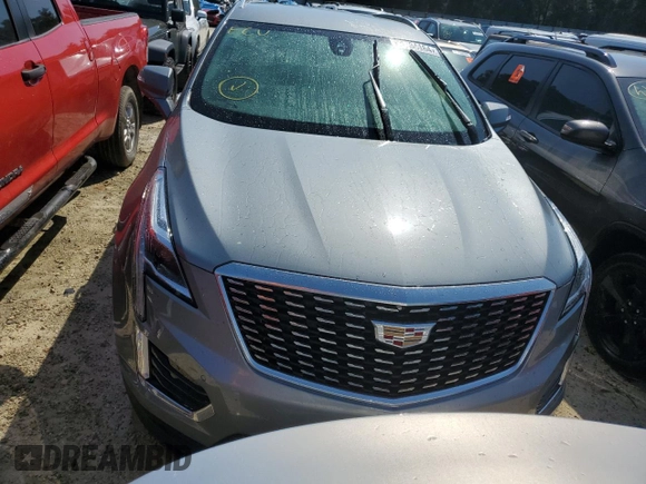 2023 Cadillac XT5 FWD Luxury z VIN 1GYKNAR4XPZ144533, wystawiony jako Copart lot #74734164 z przebiegiem Nie podano mil oraz Nie do naprawy • Non repairable. Historia ofert i sprzedaży dostępna na DreamBid. Obrazek 5.
