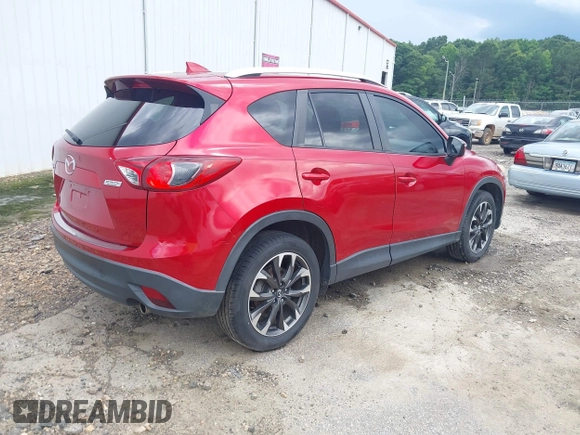 2016 Mazda CX-5 Grand Touring z VIN JM3KE2DY6G0693678, wystawiony jako IAAI lot #42443247 z przebiegiem 127 620 mil mil oraz . Historia ofert i sprzedaży dostępna na DreamBid. Obrazek 4.