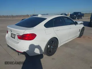 2015 BMW 4 Series 435i with VIN WBA4B1C59FD955497, listed as a IAAI auction lot 41174096 with 101,047 mi miles and . Bid and sale history available at carsss.com. Image 4.