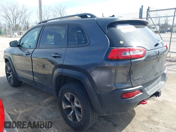 2015 Jeep Cherokee Trailhawk z VIN 1C4PJMBS3FW520328, wystawiony jako IAAI lot #41746017 z przebiegiem 83 485 mil mil oraz . Historia ofert i sprzedaży dostępna na DreamBid. Obrazek 3.