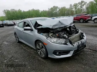2017 Honda Civic EX-L z VIN 19XFC1F74HE209787, wystawiony jako Copart lot #56352415 z przebiegiem 130 264 mil mil oraz Szkoda całkowita • Salvage title. Historia ofert i sprzedaży dostępna na DreamBid. Obrazek 14.