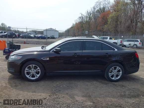 2013 Ford Taurus SEL with VIN 1FAHP2E87DG220389, listed as a IAAI auction lot 41930118 with 128,324 mi miles and . Bid and sale history available at carsss.com. Image 14.