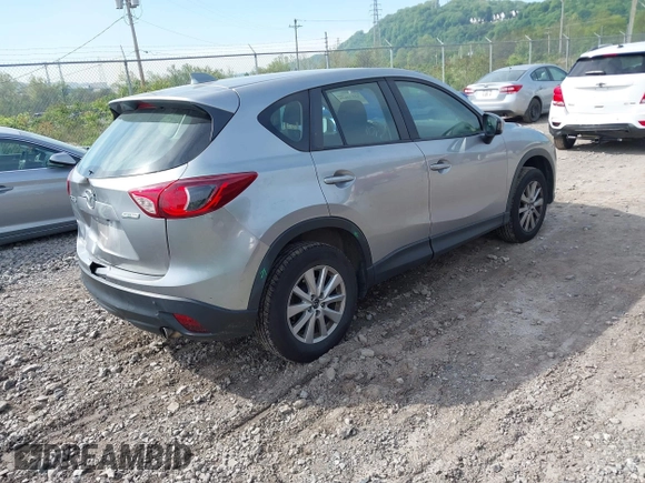 2014 Mazda CX-5 Sport with VIN JM3KE2BE9E0423737, listed as a IAAI auction lot 42222646 with 116,160 mi miles and . Bid and sale history available at DreamBid. Image 4.