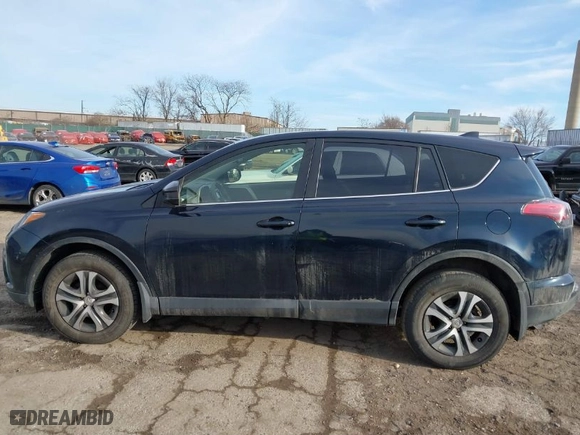 2018 Toyota RAV4 LE with VIN JTMBFREV5JD253342, listed as a IAAI auction lot 41656581 with 243,791 mi miles. Bid and sale history available at carsss.com. Image 15.