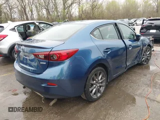 2018 Mazda 3 Touring with VIN 3MZBN1V35JM217641, listed as a IAAI auction lot 41943433 with 64,884 mi miles. Bid and sale history available at carsss.com. Image 4.