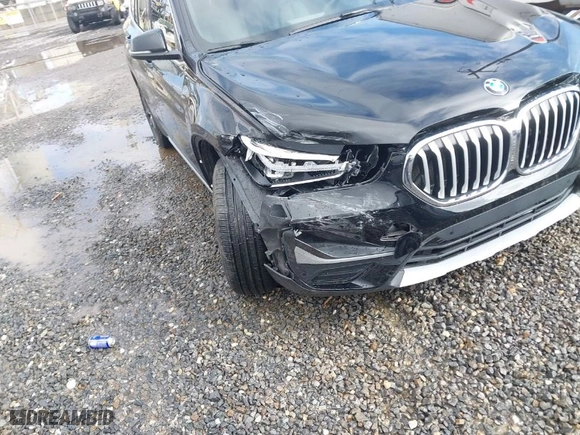 2021 BMW X1 xDrive28i with VIN WBXJG9C03M5S33561, listed as a IAAI auction lot 41541581 with NaN miles. Bid and sale history available at carsss.com. Image 6.