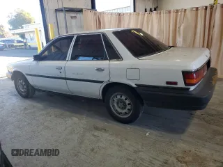 1991 Toyota Camry z VIN 4T1SV24E0MU402588, wystawiony jako Copart lot #82920114 z przebiegiem 124 644 mil mil oraz Szkoda całkowita • Salvage title. Historia ofert i sprzedaży dostępna na DreamBid. Obrazek 2.