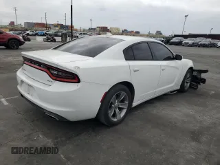 2015 Dodge Charger SXT z VIN 2C3CDXHG7FH721601, wystawiony jako Copart lot #58253925 z przebiegiem 123 004 mil mil oraz Szkoda całkowita • Salvage title. Historia ofert i sprzedaży dostępna na DreamBid. Obrazek 3.