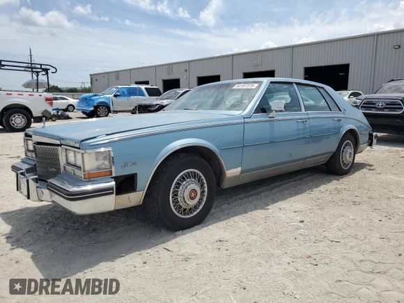1985 Cadillac Seville z VIN 1G6KS6985FE825187, wystawiony jako Copart lot #54197375 z przebiegiem 2 706 mil mil oraz Czysty tytuł • Clean title. Historia ofert i sprzedaży dostępna na DreamBid. Obrazek 1.
