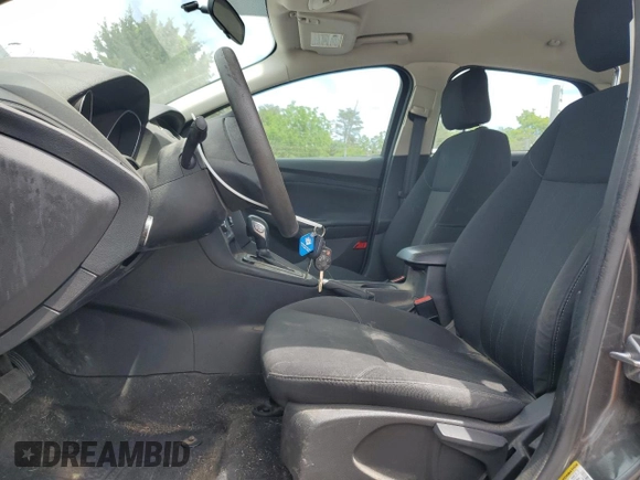 2017 Ford Focus SE with VIN 1FADP3F2XHL201380, listed as a Copart auction lot 56942815 with 136,169 mi miles and Salvage title. Bid and sale history available at DreamBid. Image 7.