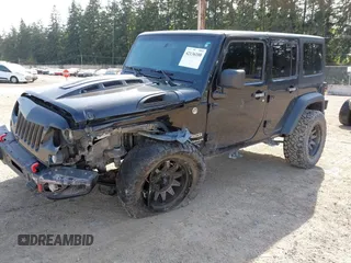 2015 Jeep Wrangler Unlimited Willys Wheeler with VIN 1C4BJWDG9FL750049, listed as a IAAI auction lot 42136188 with 115,328 mi miles and . Bid and sale history available at DreamBid. Image 2.