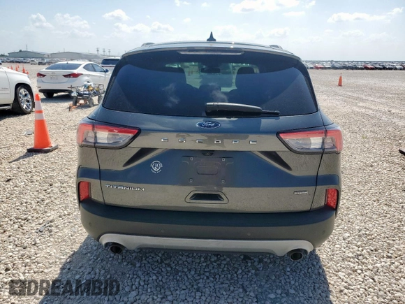 2020 Ford Escape Titanium Hybrid z VIN 1FMCU0DZ1LUC38345, wystawiony jako Copart lot #59628985 z przebiegiem 86 917 mil mil oraz Szkoda całkowita • Salvage title. Historia ofert i sprzedaży dostępna na DreamBid. Obrazek 6.