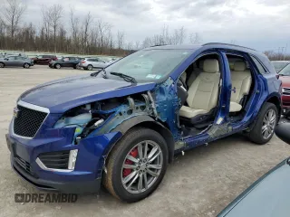 2023 Cadillac XT5 AWD Sport with VIN 1GYKNGRS7PZ123527, listed as a Copart auction lot 52861545 with 27,749 mi miles and Salvage title. Bid and sale history available at DreamBid. Image 1.