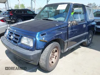 1997 Chevrolet Tracker z VIN 2CNBE1865V6926154, wystawiony jako IAAI lot #42207157 z przebiegiem 176 104 mil mil oraz . Historia ofert i sprzedaży dostępna na DreamBid. Obrazek 2.