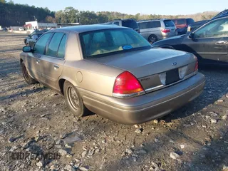 2002 Ford Crown Victoria LX z VIN 2FAFP74W32X159473, wystawiony jako IAAI lot #41759610 z przebiegiem 86 523 mil mil oraz . Historia ofert i sprzedaży dostępna na DreamBid. Obrazek 3.